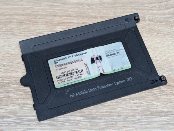 Б/В Сервісна кришка HDD для ноутбука HP Compaq nc6110, nc6120, nc6320, nc6400,nx6110, nx6115, nx6125, nx6325